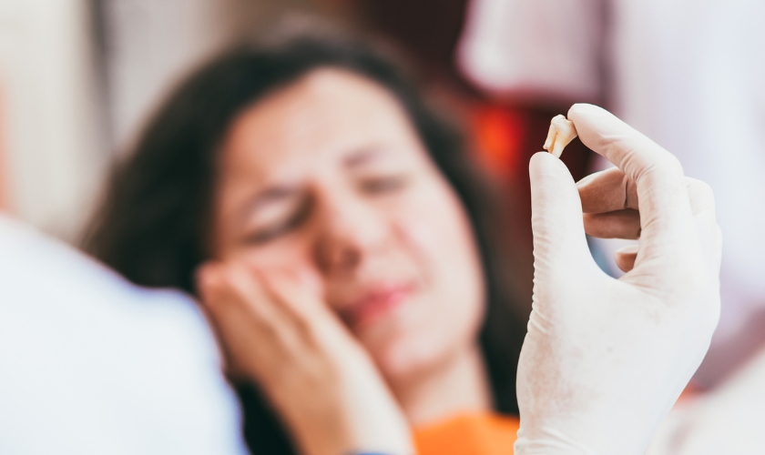 Patient experiencing dry socket after tooth extraction