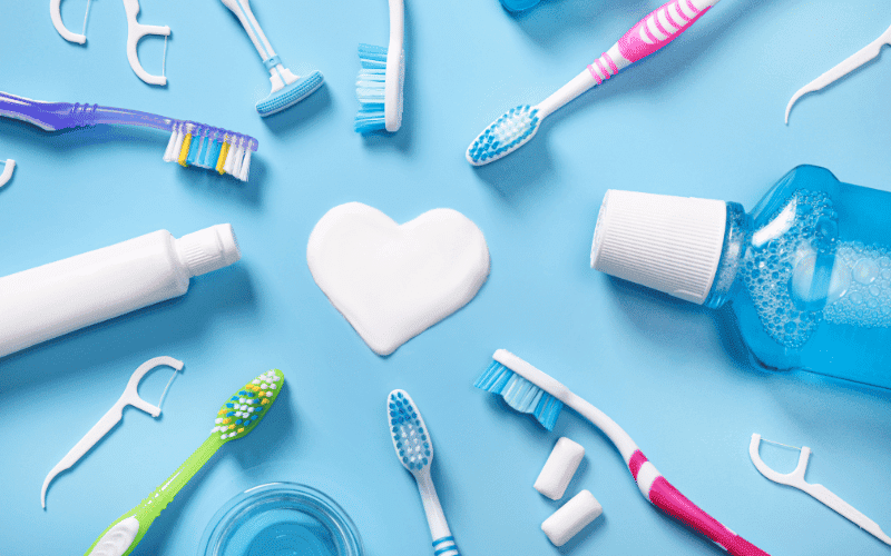 Dental care products arranged on a blue background
