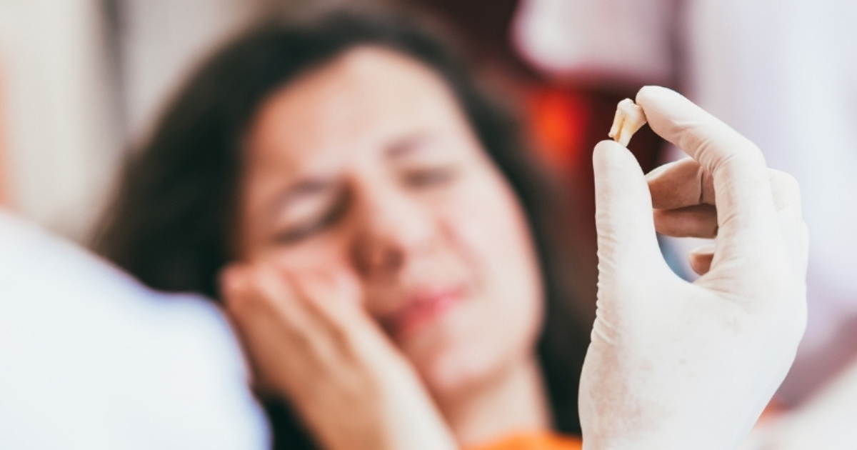Patient experiencing discomfort after a tooth extraction