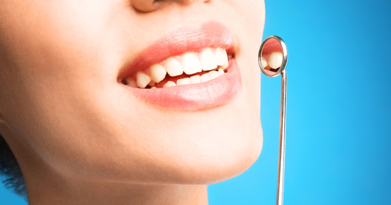Smiling patient showing results of cosmetic dentistry treatment