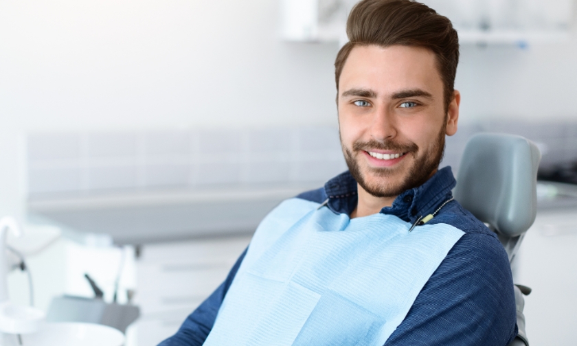 Smiling man in a dental office