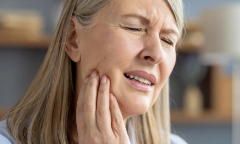 Woman experiencing tooth pain and jaw discomfort