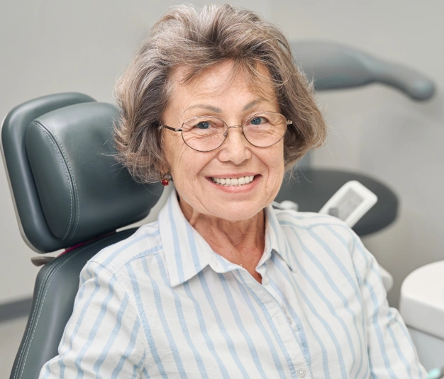 Senior woman smiling with dentures