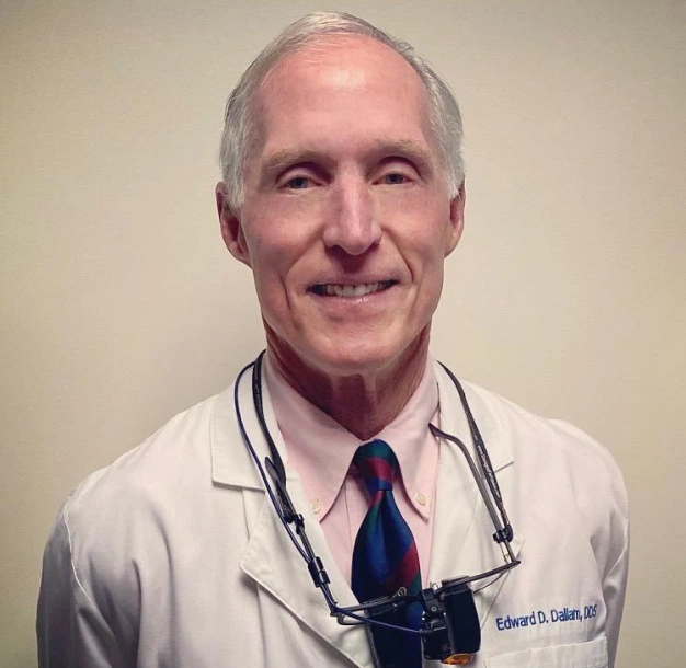 Dr. Edward Dallam smiling in a professional portrait