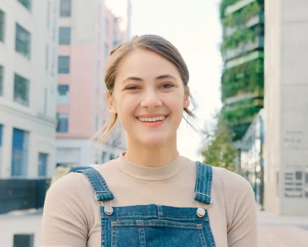 Smiling woman standing outdoors