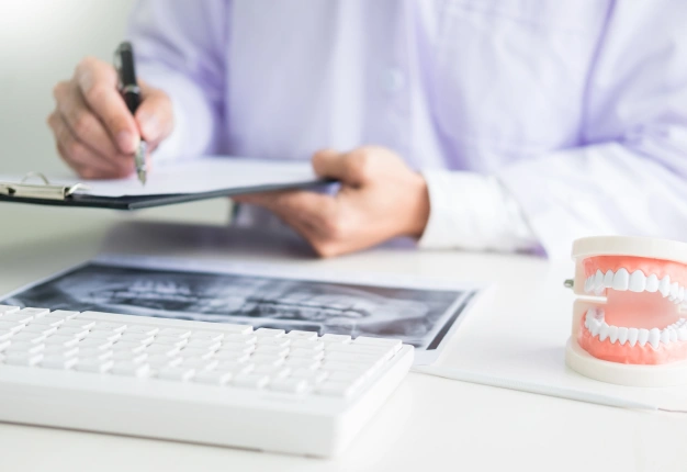 Dental professional reviewing treatment and financing documents