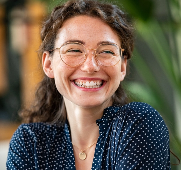 Woman smiling after gum disease treatment