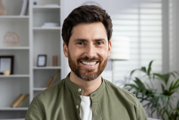 Man smiling after restorative dentistry treatment