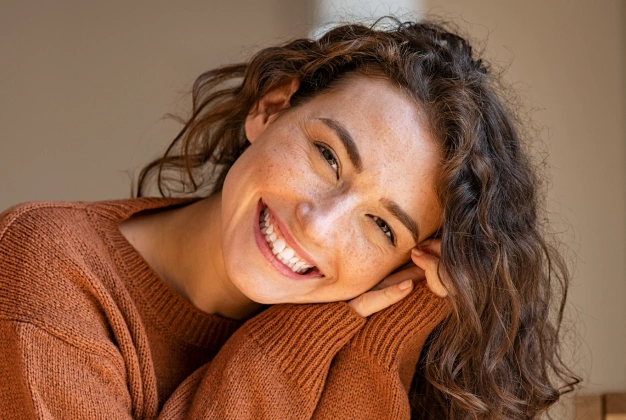 Woman with wavy hair smiling