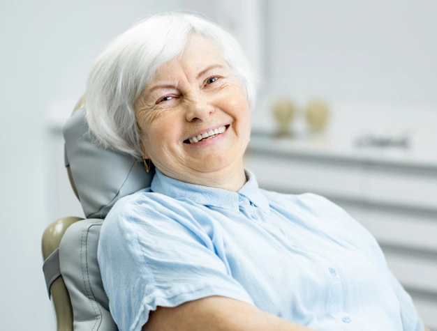 Senior woman smiling after root canal therapy