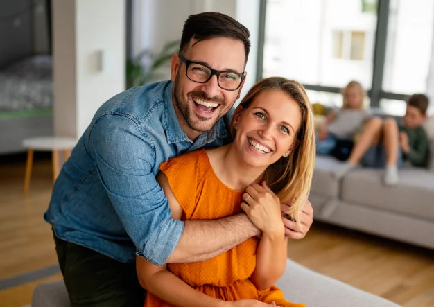 Couple smiling together indoors
