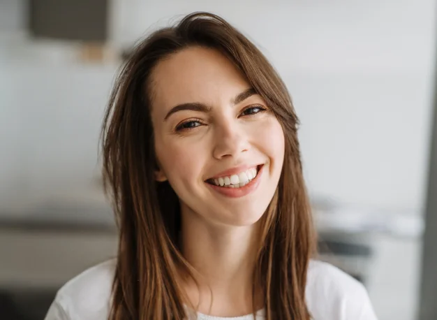Woman smiling with long brown hair