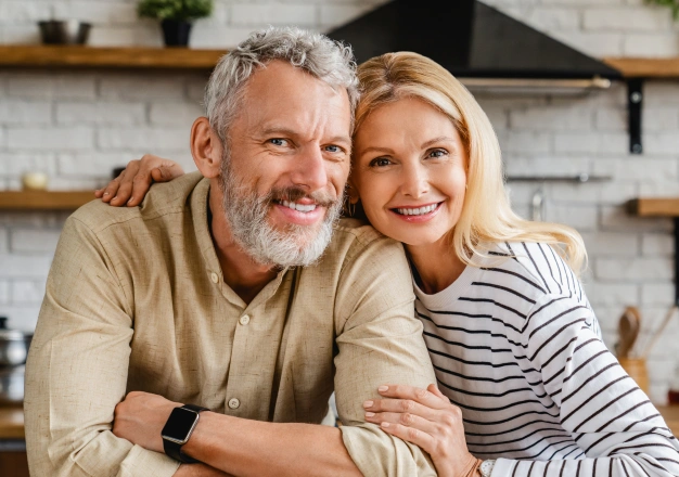 Couple smiling and posing for a photo
